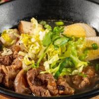Beef-Stew Noodle Soup · A traditional Chinese noodle dish with seasoned beef that has been stewed for hours and ladl...