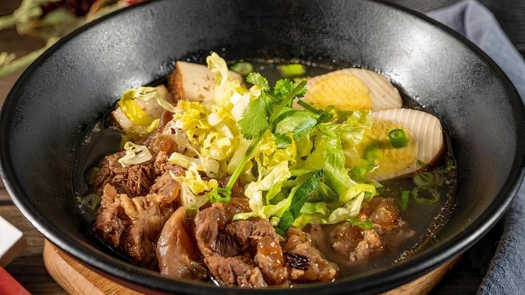 Beef-Stew Noodle Soup · A traditional Chinese noodle dish with seasoned beef that has been stewed for hours and ladled with a hearty beefy broth.