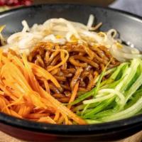 Zha Jiang Mian · A traditional Chinese noodle dish with seasoned beef that has been stewed for hours and ladl...