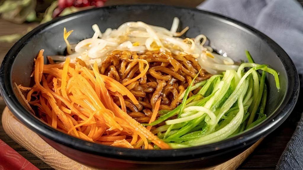 Zha Jiang Mian · A traditional Chinese noodle dish with seasoned beef that has been stewed for hours and ladled with a hearty beefy broth.