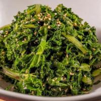 Kale Salad In Sweet & Sour Dressing · Blanched Kale tossed with sweet & souring dressing and topped off with toasted sesame seeds.