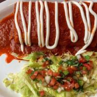 Wet Burrito · Served with beans, rice, and choice of meat, topped with homemade red enchilada sauce, sour ...