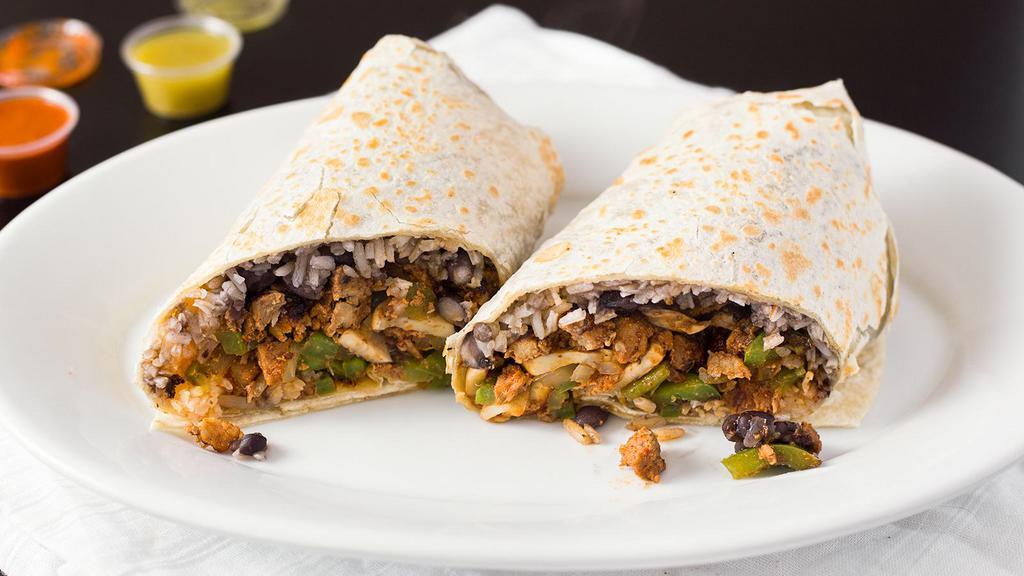 Fajita Burrito · Served with beans, rice, grilled onions, mushrooms,  green bell peppers with choice of meat.