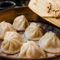 Xiaolong Bao Soup Dumplings · 6 plump pork dumplings, steamed and served with a soy-ginger dipping sauce. Shanghai
.