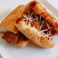 Meatball Parmesan Sandwich (Medium) · Meatballs, marinara sauce with provolone cheese dashed with oregano and Parmesan cheese. Ser...