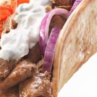 Gyro · A Seasoned Blend of Lamb and Beef Thinly Sliced with Freshly Sliced Tomatoes and Finely Chop...