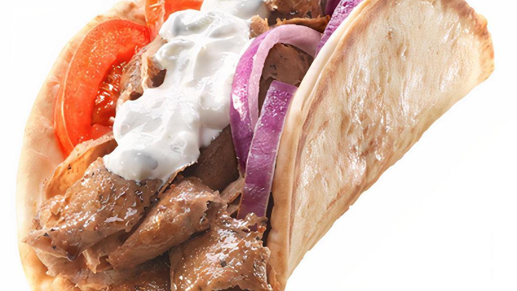 Gyro · A Seasoned Blend of Lamb and Beef Thinly Sliced with Freshly Sliced Tomatoes and Finely Chopped Red Onions with Fresh Tzatziki (Greek Cucumber Yogurt Sauce) Wrapped together in a Warm Pita Bread.