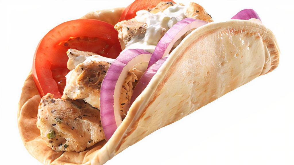 Chicken Souvlaki Sandwich · Diced Mediterranean-Marinated Chicken with Freshly Sliced Tomatoes and Finely Chopped Red Onions with Tzatziki (Greek Cucumber Yogurt Sauce) wrapped together in a Warm Pita Bread.
