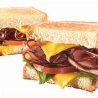 Deluxe Ham & Cheese · Grilled, Thinly-Sliced Black Forest Ham with Melted American cheese between Two Pieces of Th...
