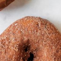 Cinnamon & Sugar Cake Donuts · Our vanilla cake donut fried and tossed in a sweet mix of cinnamon and sugar.