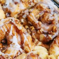Sticky Buns · Our large sticky buns rolled in cinnamon, nuts and topped with a sweet glaze.