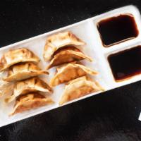 Potstickers · (6 pieces). Chicken with mixed vegetable dumplings (steam or grill). served with dumpling sa...