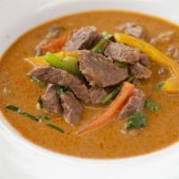 Panang Curry · Panang curry paste with coconut milk, white onions, carrots, lemon leaves, and your choice o...