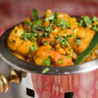 Aloo Gobi · Cauliflower with potatoes cooked with herbs and spices.