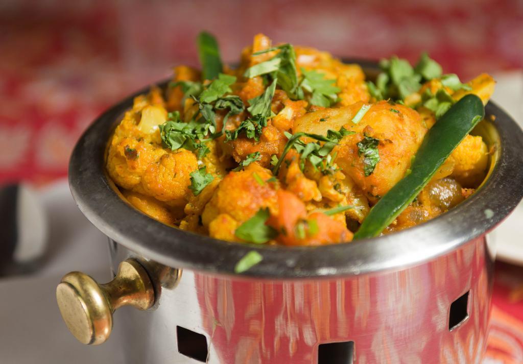 Aloo Gobi · Cauliflower with potatoes cooked with herbs and spices.
