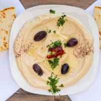 Hummus With Pita · A dip made frim cooked, mashed chickpeas blended with tahini, olive oil, lemon juice, salt a...