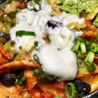 Xl Nachos · Red or green chile con queso, refried beans, scallions, tomatoes, olives, jalapeños, chopped...