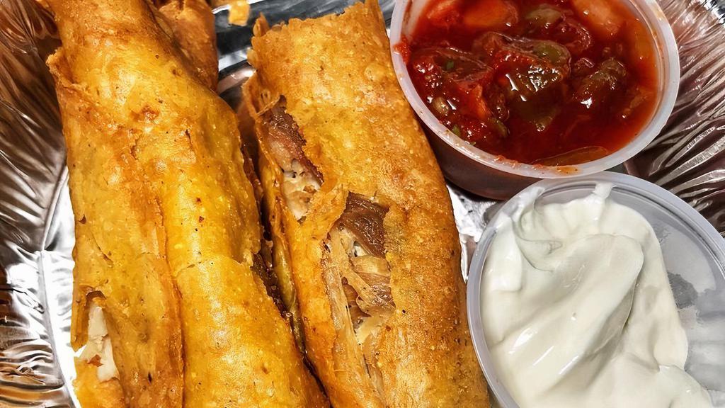 Chicken Taquitos 3 Pcs · Large rolled tacos served with chile con queso.