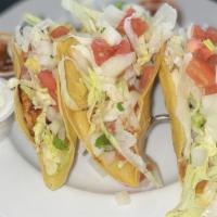 3 Taco Plate · Three tacos with your choice of meat with Cheddar, lettuce, tomatoes, onions, and cilantro.