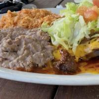 Enchiladas Del Nuevo Mexico · Three stacked blue corn enchiladas with choice of meat, Cheddar, red or green chile, topped ...