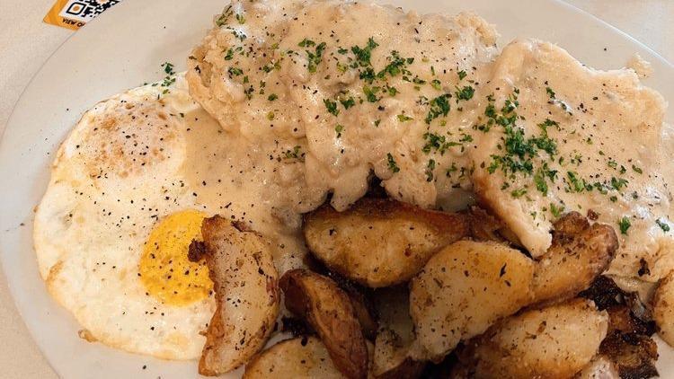 Biscuits & Gravy · Two eggs, two freshly baked biscuits, sausage gravy.