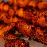 Chicken Tikka Kebab · Boneless pieces of chicken marinated in an exotic mixture of spices and yogurt and grilled i...