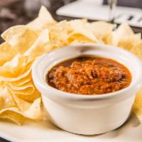 Chips And Salsa · Warm tortilla chips and oven-roasted salsa.
