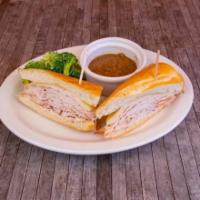 Spit Roasted Turkey Dip · Rotisserie Turkey shaved to order, Jack cheese, and mayonnaise on toasted French roll with w...