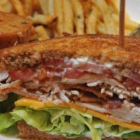 Rustic Club Sandwich · Marinated turkey, roasted and sliced with smoked bacon, cheddar, lettuce, tomato and mayonna...