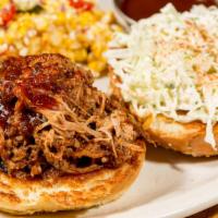12 Hour Pulled Pork Sandwich · Slow roasted, Memphis style pulled pork in signature BBQ sauce with creamy slaw, and pickles.
