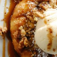 Freshly Baked Apple Pie · A warm flaky puff pastry filled with cinnamon apples. Topped with walnuts, caramel and Frenc...