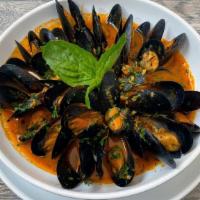 Mussels Fra Diavolo · Sautéed mussels in spicy marinara sauce
