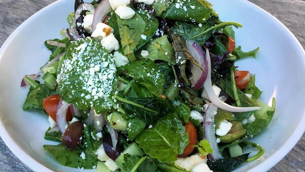 Greek Salad · Mixed greens, cucumbers, red onion, cherry tomatoes, feta cheese, Kalamata & Castelvetrano olives in an herb vinaigrette