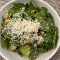 Side Caesar Salad · Romaine, crushed homemade herb croutons, shaved Parmesan & Caesar dressing