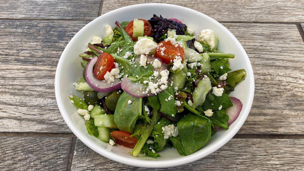 Side Greek Salad · Mixed greens, cucumbers, red onion, cherry tomatoes, feta cheese, Kalamata & Castelvetrano olives in an herb vinaigrette