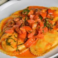 Ravioli · Five cheese ravioli topped with pomodoro sauce