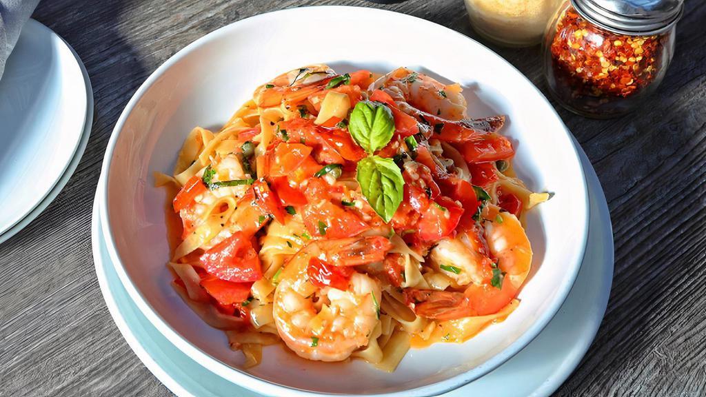 Shrimp Scampi · Tomatoes & capers in a white wine sauce with tagliatelle
