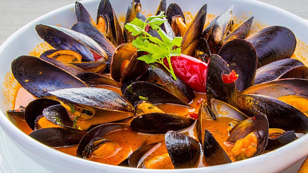 Mussels Fra Diavolo · Sautéed mussels in a spicy marinara sauce