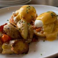 Salmon Benedict · Lemon, parsley, poached eggs & hollandaise on toast points. Served with breakfast potatoes