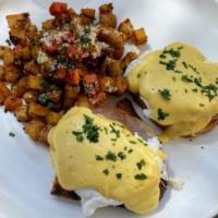 Traditional Benedict · Canadian bacon, poached eggs & hollandaise on toast points. Served with breakfast potatoes