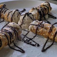 4 Mini Cannoli · Crispy Italian pastries filled with sweet chocolate chip ricotta, dusted with powdered sugar...