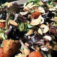 Arugula Caesar Salad (Vegan Dressing) · Arugula, blistered tomatoes, toasted almonds, blue corn foccacia croutons, grana padano,  ho...