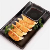 Vegetable Gyoza · 餃子（野菜） Pan-fried dumpling stuffed with vegetables, served with a soy vinegar dipping sauce