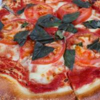 Margherita Pizza · Mozzarella, San marzano tomato sauce and basil.