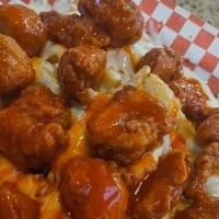 Buffalo Chx Fries · Boneless wings over fries, smothered in mozzarella, blue cheese crumbles, spicy buffalo sauc...