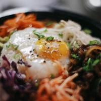 Bibimbop · Sauteed and Seasoned Vegetable and Bulgogi Beef served over Steamed rice and fried egg.