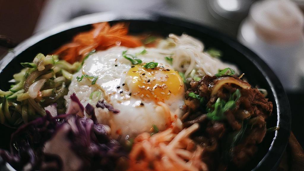 Bibimbop · Sauteed and Seasoned Vegetable and Bulgogi Beef served over Steamed rice and fried egg.