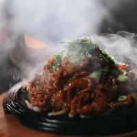 Beef Bulgogi · Thin sliced Beef Rib-Eye Marinated with House Korean Bulgogi Sauce server over rice.