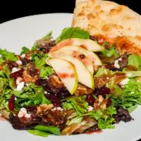 Four Seasons Salad · Field greens, sliced Apples, candied walnuts, dried cranberries and goat cheese, topped with...
