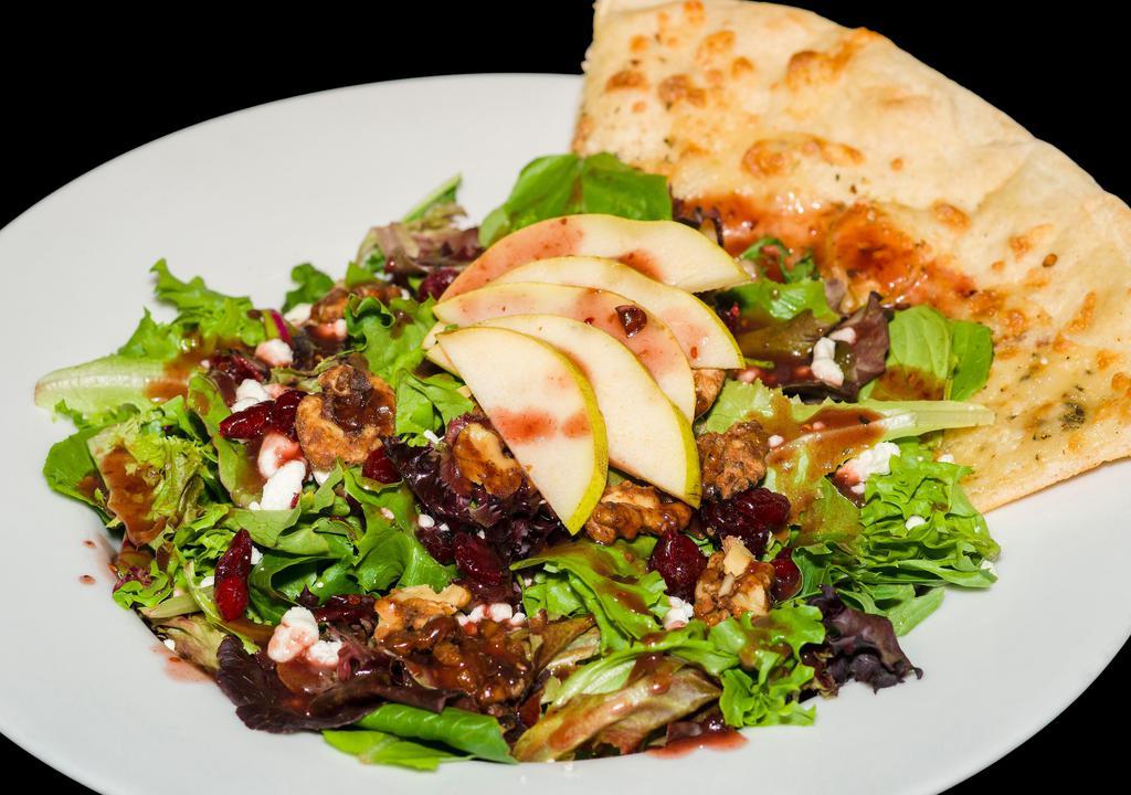 Four Seasons Salad · Field greens, sliced Apples, candied walnuts, dried cranberries and goat cheese, topped with homemade maple raspberry vinaigrette and served over a 